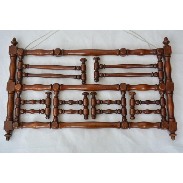 P0320 stylish and very attractive wall mounted, turned coat and hat rack, originally used as wig rack, having two long and...