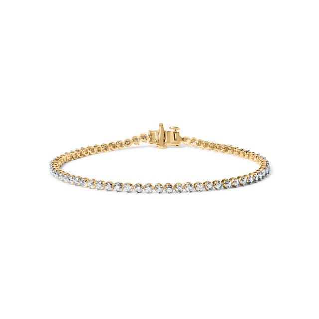 Envelop your wrist in the sheer elegance of this sterling silver tennis bracelet, exquisitely plated in radiant 10K yellow...