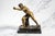 A striking decorative sculpture inspired by the celebrated Borghese Gladiator, this vintage cast metal figure captures the...