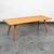 Iconic Paul McCobb solid maple coffee table. Sleek, slim tabletop supported by splayed and tapered legs. Designed by Paul...