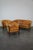 Offered is this unique old set of 2 club chairs and a sofa in cognac colored leather, wood trim, queen Ann legs and...