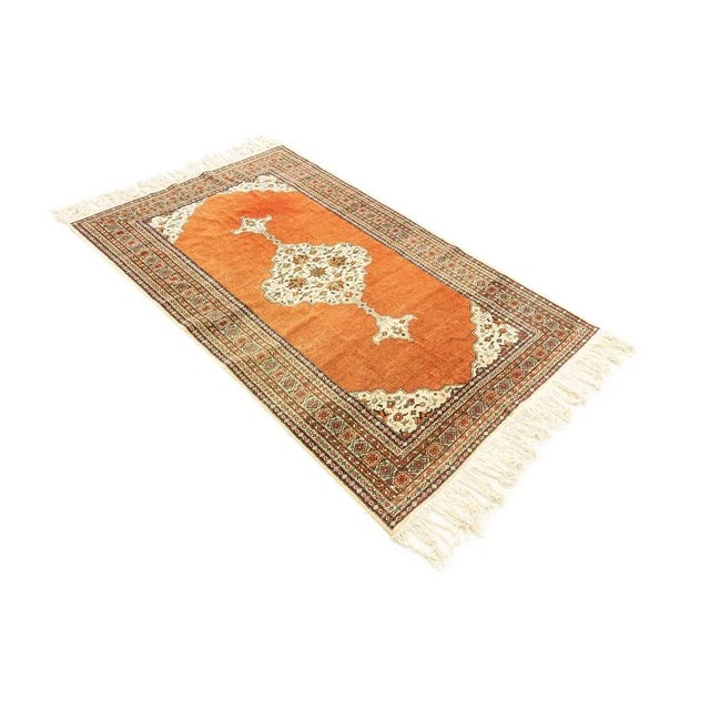 Classic Ardebil carpet from the 1960s with wonderful fringes. High quality pile with a medallion on a rust red ground and...