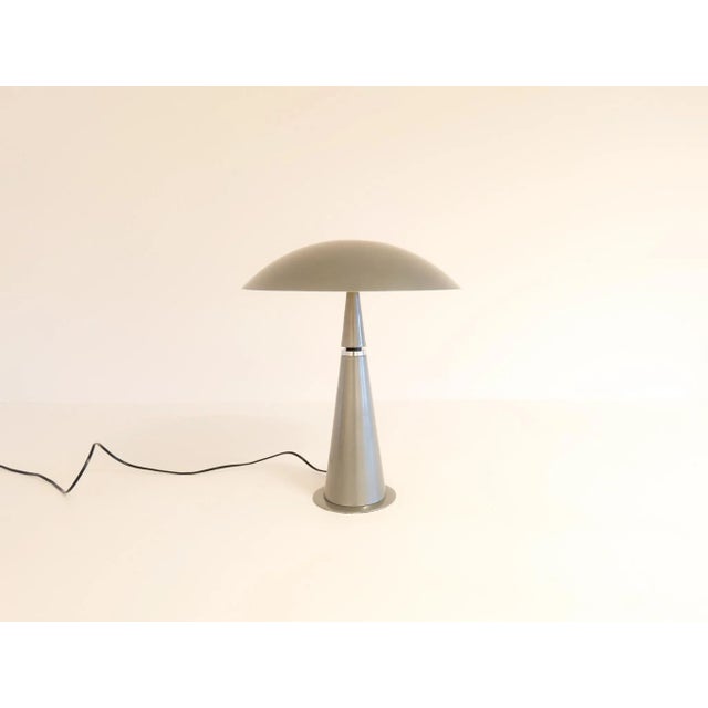 This wonderful table lamp was produced in France for Aluminor during the 1990s. With its cone formed base and mushroom...