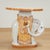 Mid century Italian elephant stand crafted in terra cotta, with a removable top, hand decorated in delightful pastel...