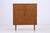 Vintage linen cupboard from the 1960s. The framed doors and warm wood finish give the cupboard a serene mid-century modern...