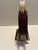 This is a vibrant hand made rustic Folk Art painted wood eagle perched on a tree limb. The painted colors of dark reddish...