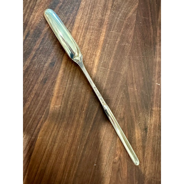 Antique sterling silver marrow spoon. 8 7/8 inches long. Hallmarks on the underside of the stem include a lion passant,...