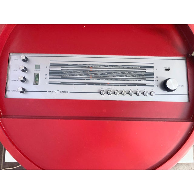 A side table on a trumpet base with a hinged top and built-in radio, by Ilse Möbel (Nordmende radio) from the 1960s....