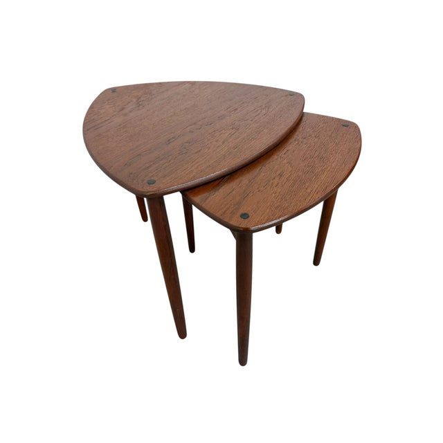Add iconic Danish Modern style to your space with this set of 1960s guitar pick nesting tables. Featuring distinctive...