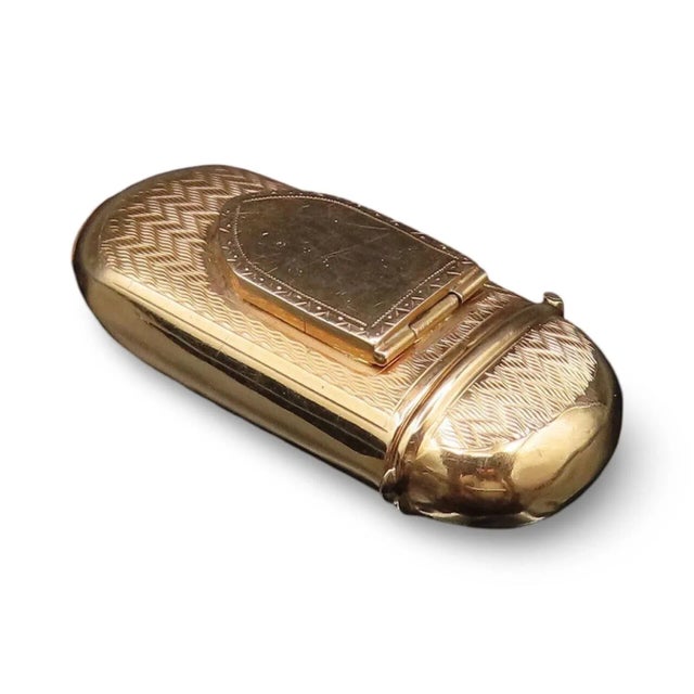 A rare and exquisite 19th-century French match safe, or étui, crafted in gleaming 18-karat gold with intricate hand-...