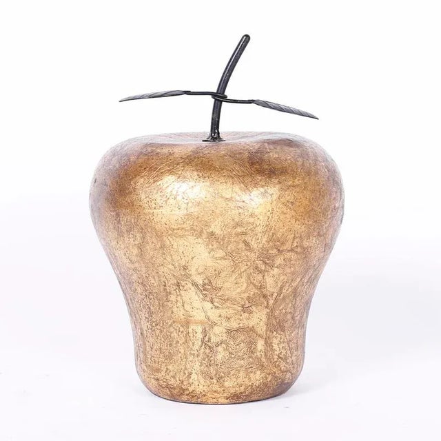 Large sculptural apple and pear crafted in porcelain and decorated with textured gold leaf with metal leaves. Italy circa...