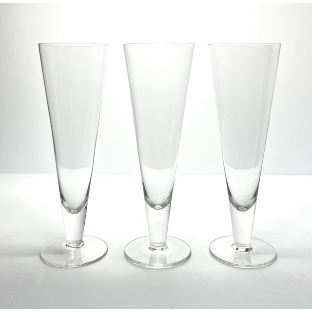 Crate & Barrel 3 Footed Beer Pilsner or Fluted Champagne Glasses 9 5/8” 16oz Excellent condition. No chips, cracks, or...