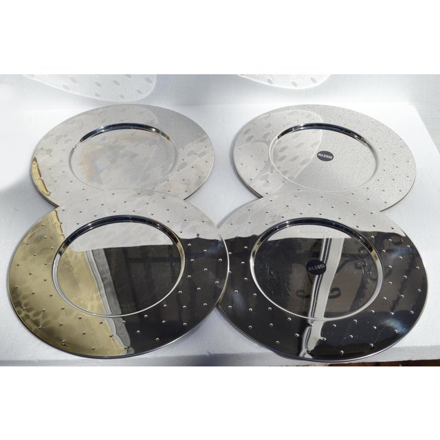 Original Boxed Set of 4 Alessi MG03 stainless steel plates or underplates, designed by Michael Graves as part of his...