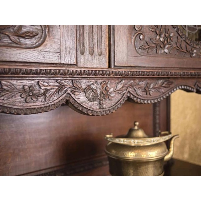 Tall Norman cabinet made of solid oak with stained glass windows. The stained glass windows have been completely renovated...