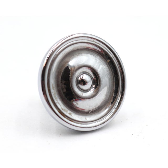 Modern style brass round concentric drawer knob with a chrome finish. A mounting screw is included. Good condition with...