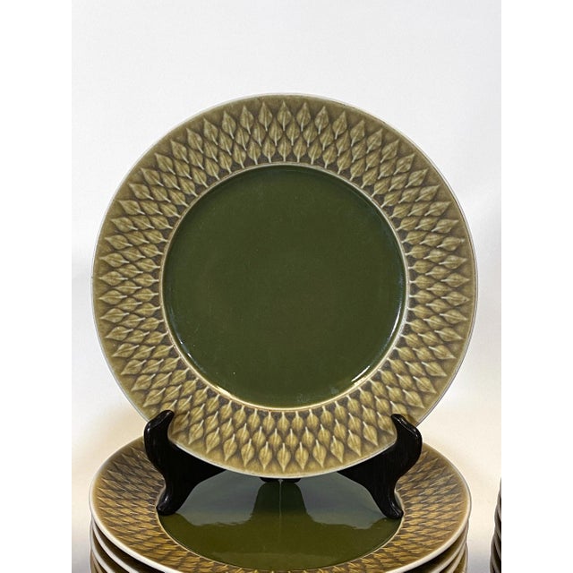 A 1980's Danish dinnerware set of 91 pieces designed by Jens Harald Quistgaard for the "Relief"' collection. The set was...