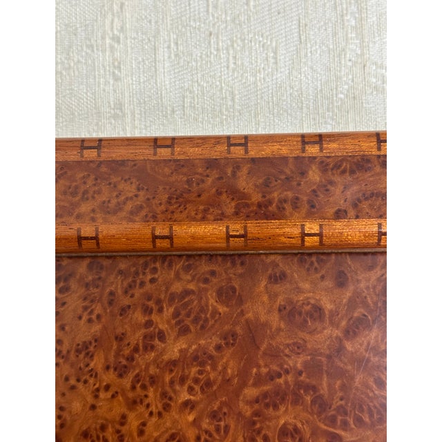A rare and unique lacquered burlwood notepad holder produced by Hermes, likely in the 1980s. Very good condition with...
