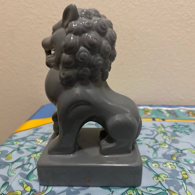 The smooth glaze accentuates the detailed contours of the mane, musculature, and fierce expression. Featuring a hollow...