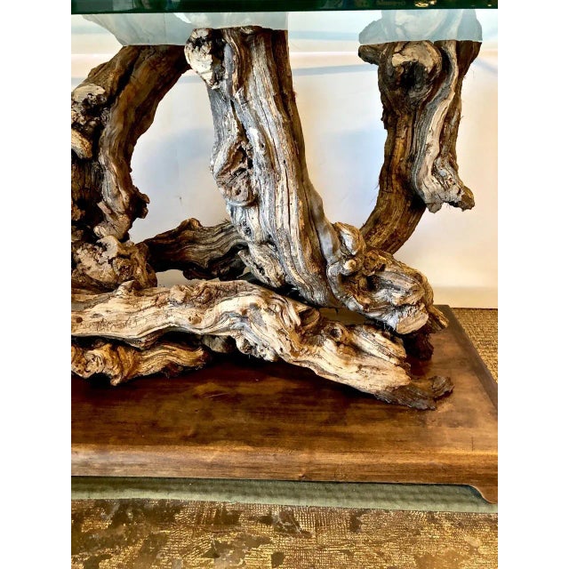 This is a superb example of a midcentury table that was created by intertwining large sculptural roots and represents the...