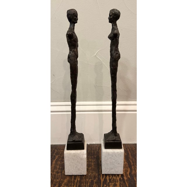 Global Views Late 20th Century Pair of Giacometti Style Male & Female Figural Sculptures on Marble Bases For Sale - Image 4 of 17