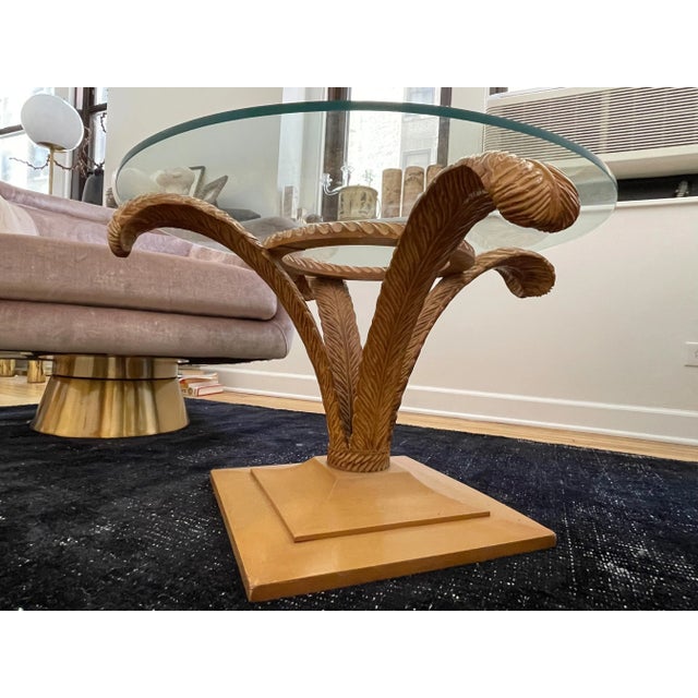 Original cocktail table by Grosfeld House, a leading brand in maximalism. Wood plinth base and four hand-carved wood and...