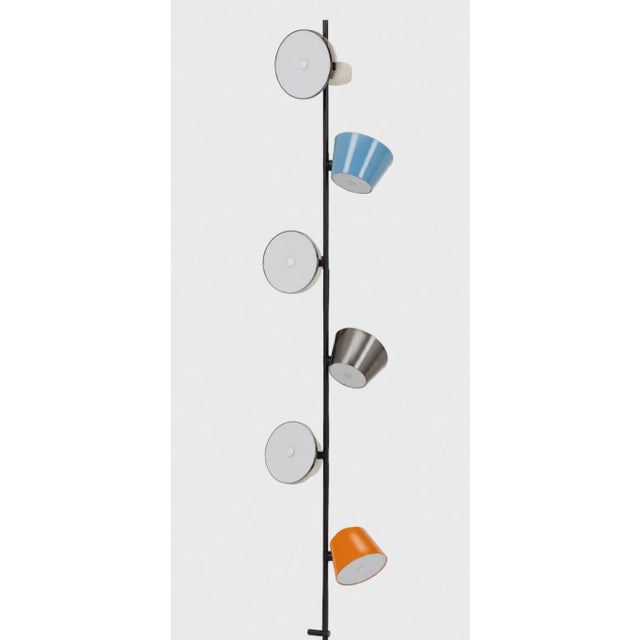 Make a dramatic contemporary statement with this unique 6-light modern metal fixture. Designed with an tall central pole...