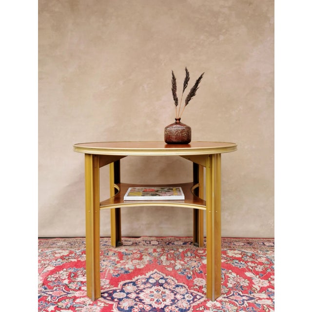 This table with additional storage area dates from the 1930s and is ideal as a couch / side table! The legs and edge...