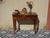 Folding games table in a simple, straight console style, made of solid walnut. Antique furniture from the 19th century....