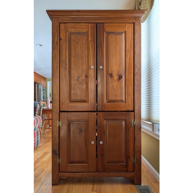Elevate your space with this beautifully hand-crafted rustic entertainment armoire, blending traditional design with...