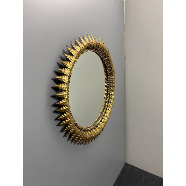 Lovely sunburst mirror often attributed to Italy but as we found this in Spain, most likely from there. The gilt metal is...