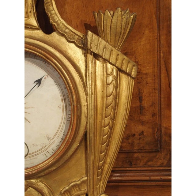This lovely giltwood barometer and thermometer was hand-carved during the Louis XVI period in Paris, France. During the...