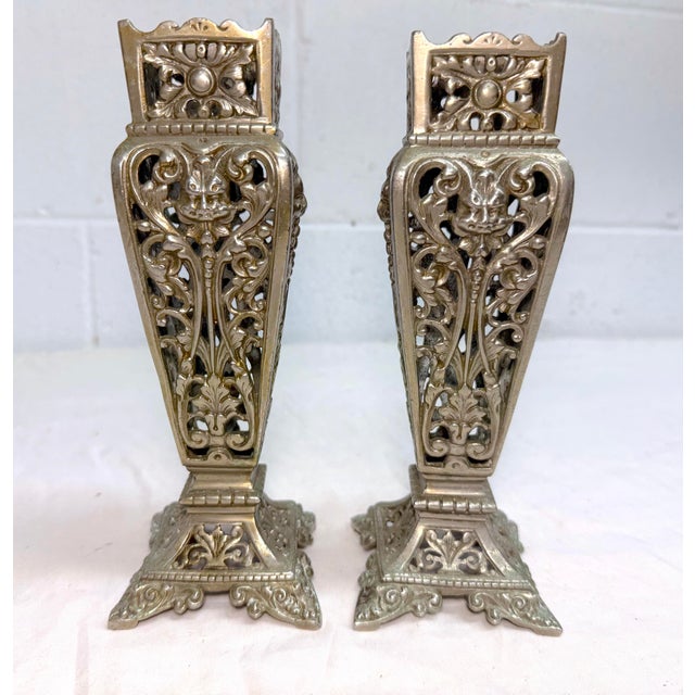 Up for sale is an exquisite pair of antique Victorian reticulated nickel-plated brass vases. Each vase features a unique...