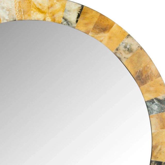 On trend with a artful marbleized frame, the arched mirror adds sparkle and shine above a console or dresser. Crafted of...
