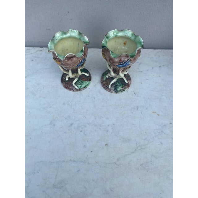 Pair of 19th century Palissy chalices vases with butterflies signed Thomas Sergent, the feets are stylized seaweeds in a...