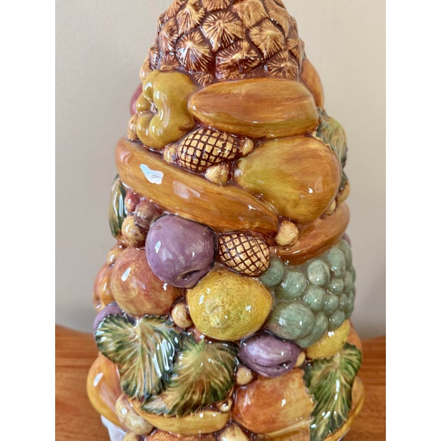 Midcentury Italian porcelain fruit topiary table lamp. Vibrantly colored fruits piled high with leaves set in a white...
