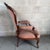 A classic armchair attributed to early 20th-century italian craftsmanship, inspired by the louis xv style. It features a...