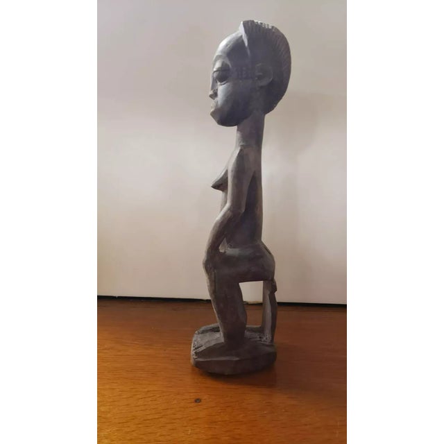 This is a Early to Mid 20th Century Luba Fertility Wood Carving from the Congo. It measures 15 1/2" high x 3 1/2" wide x 4...