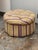 Design Plus Gallery presents a Round Tufted Ottoman from Sherrill Furniture. The ottoman has a plush round form with...
