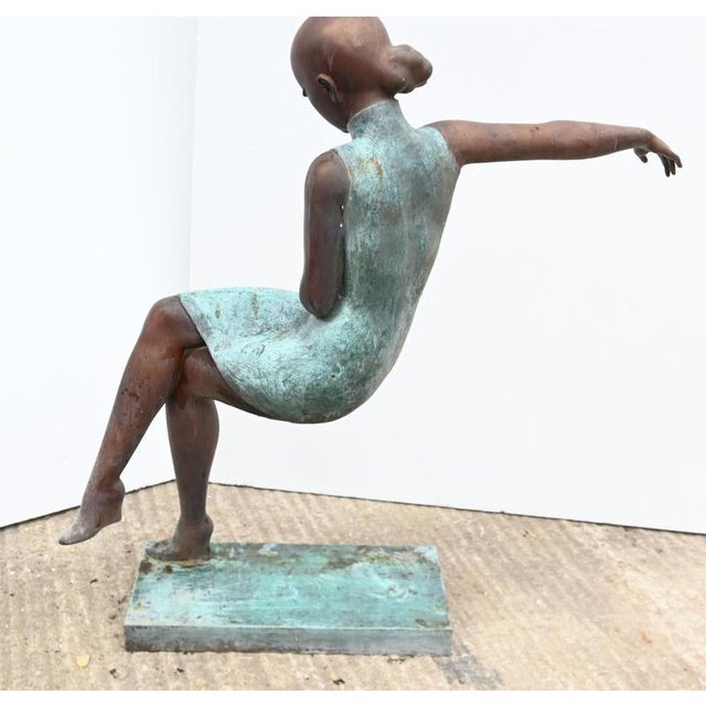 Elegant bronze art deco style sculpture of a female ballerina Almost abstract composition with the figure appearing to sit...
