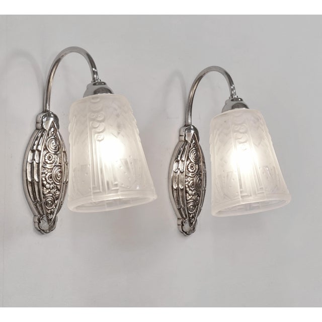 M. Hudry & Muller frères A beautiful pair of 1925-1930 French art deco wall sconces in nickel plated solid brass or bronze...