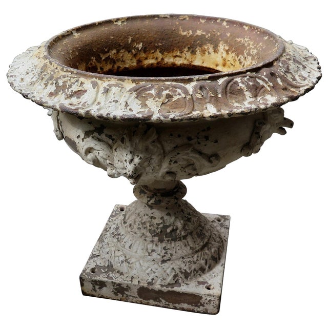 This vintage pair of Victorian solid cast iron garden urn shape planters date from the late 19th century. This exceptional...