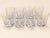 A set of eight cut crystal port glasses by daum, a true treasure of early 20th-century french glassmaking. each glass...