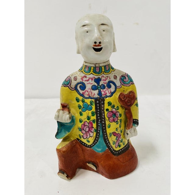Polychrome porcelain figure Figure in traditional dress Good condition Dimensions: H 18 x W 10 x D 5.5 cm 20th century