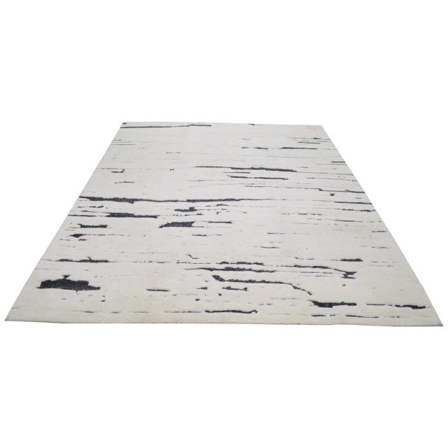 Hand-knotted with care using traditional rug-making techniques, this wool rug blends timeless craftsmanship with a modern...