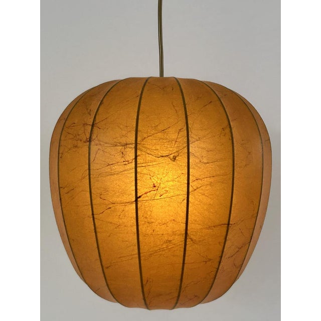 Rare, highly decorative and elegant mid-century modern cocoon pendant lamp or hanging light. Designed and manufactured...