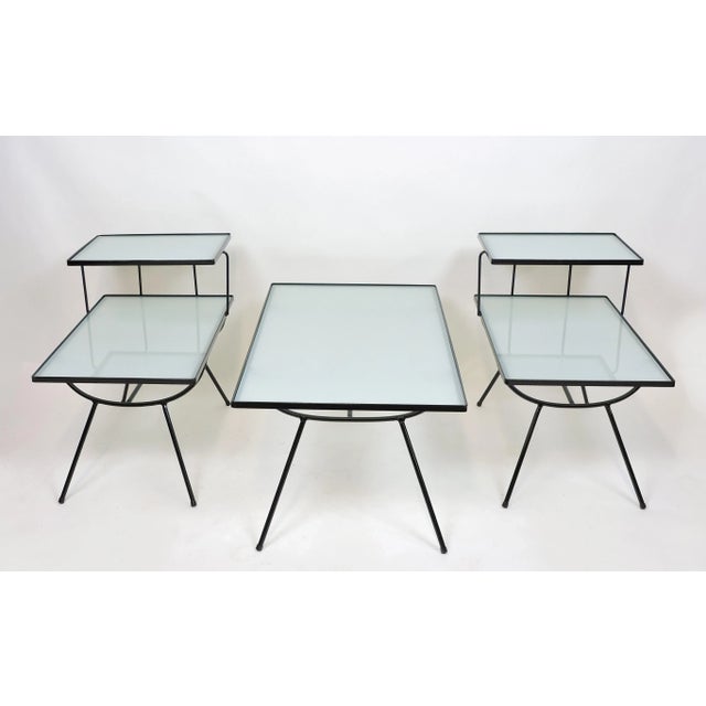 Beautiful set of three tables by Frank and Son in the style of George Nelson. This set includes a coffee table and two end...