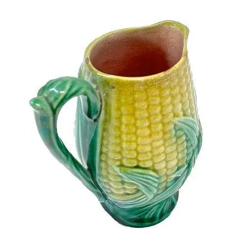 Antique small majolica corn pitcher with handle and spout. No maker's marks.