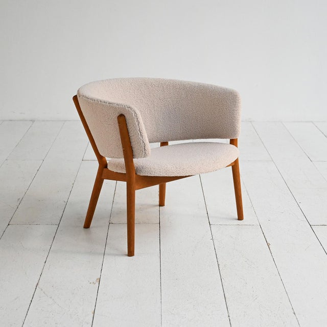 Manufactured by s.w. Møbler (denmark), designed by nanna and jørgen ditzel, 1960s. "model 83" armchair with wooden frame...