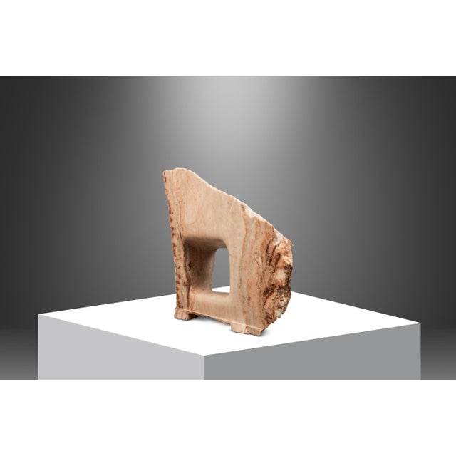 Hand-sculpted in pure, solid Colorado Pink Alabaster this fascinating "Window Into the Past" sculpture is absolutely...