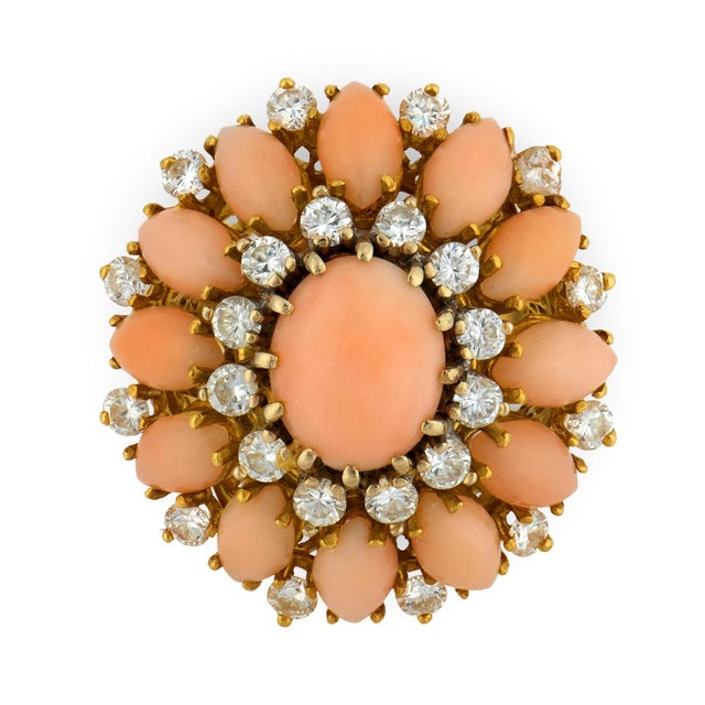 This vintage cocktail ring is a striking expression of color, texture, and confident design. At its center, a composition...
